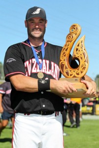 New Zealand Black Sox captain Rhys Casley with the ISF World Championship trophy. Casley's 3 run home run was the difference in the championship game. (click to enlarge)