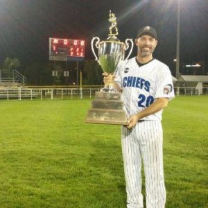 Craig Crawford of Hill United Chiefs with trophy his game-winning hit earned. (click to enlarge)