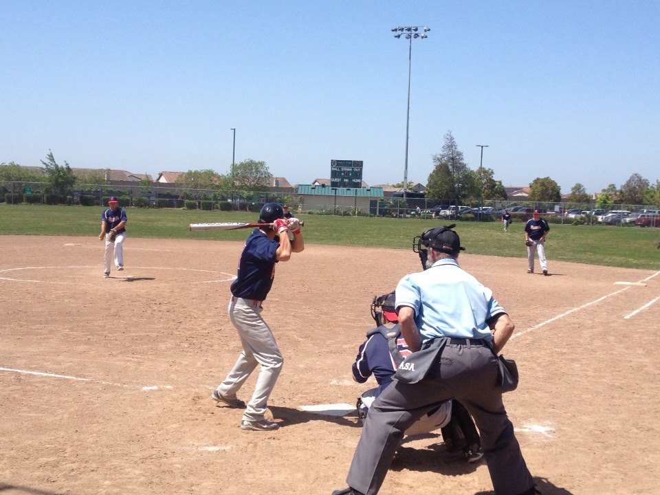 Roseville Eagles v Bay Area Merchants in the East Bay. Pitching is Ed Gaspar; at the plate is Adam Traugh; first baseman is Kevin Fontana (photo courtesy of Kary Moore, click to enlarge)